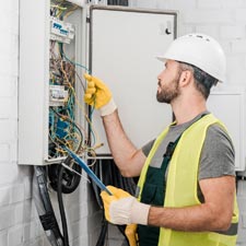 electrician working on electrical panel